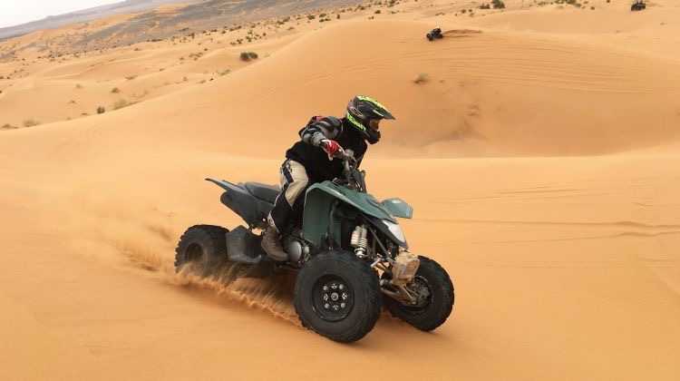 Exciting quad biking adventure in Taghazout, Morocco, exploring the stunning desert landscape near the surf camp