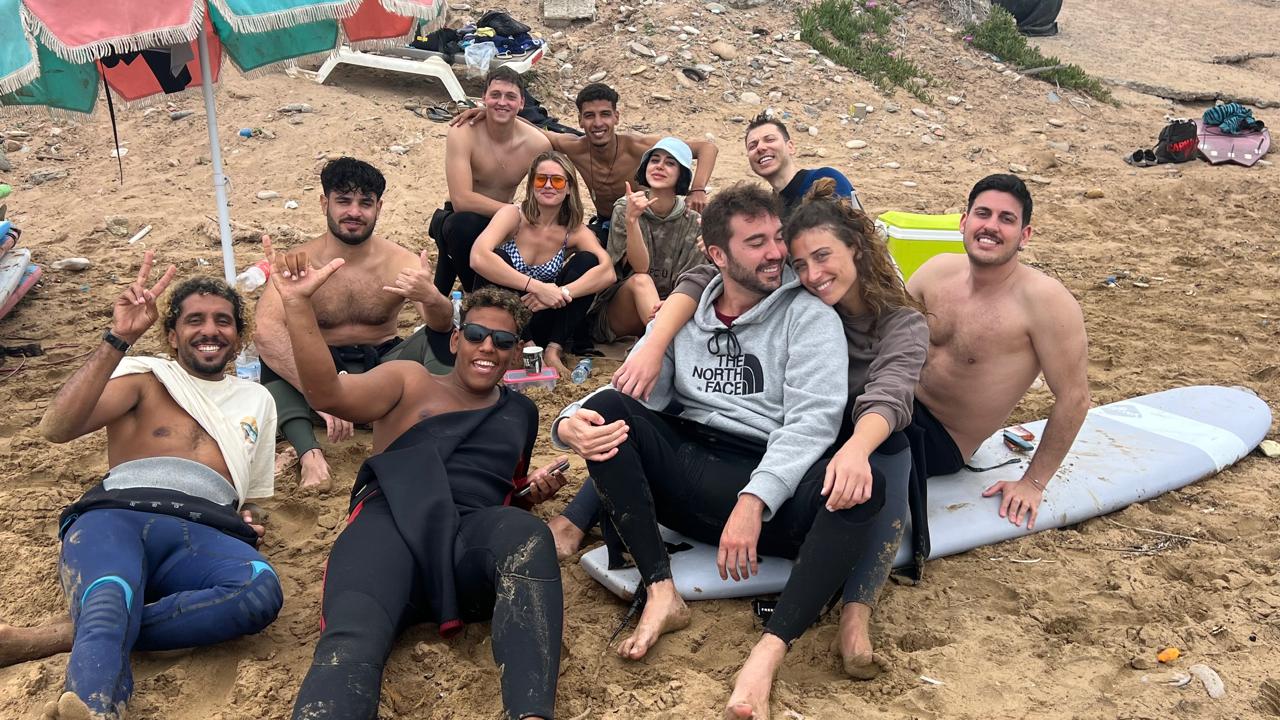 Family learning to surf in Taghazout during surf lessons Morocco