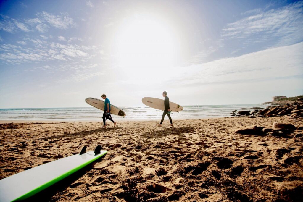 surfers in morocco during summer