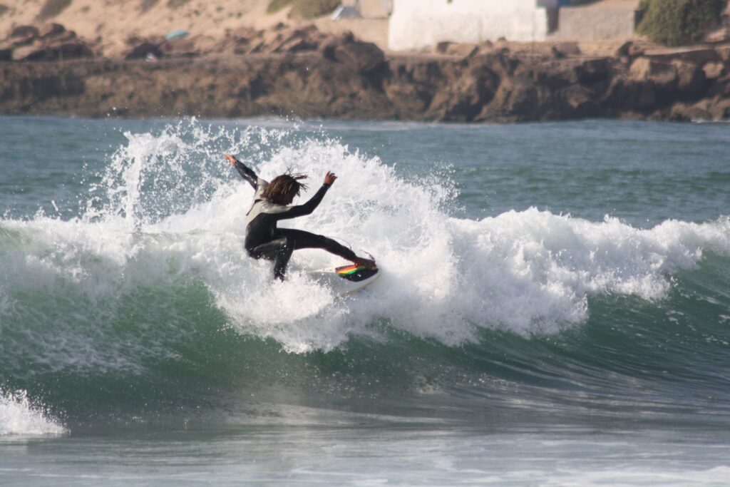 a person surfing in taghazout 