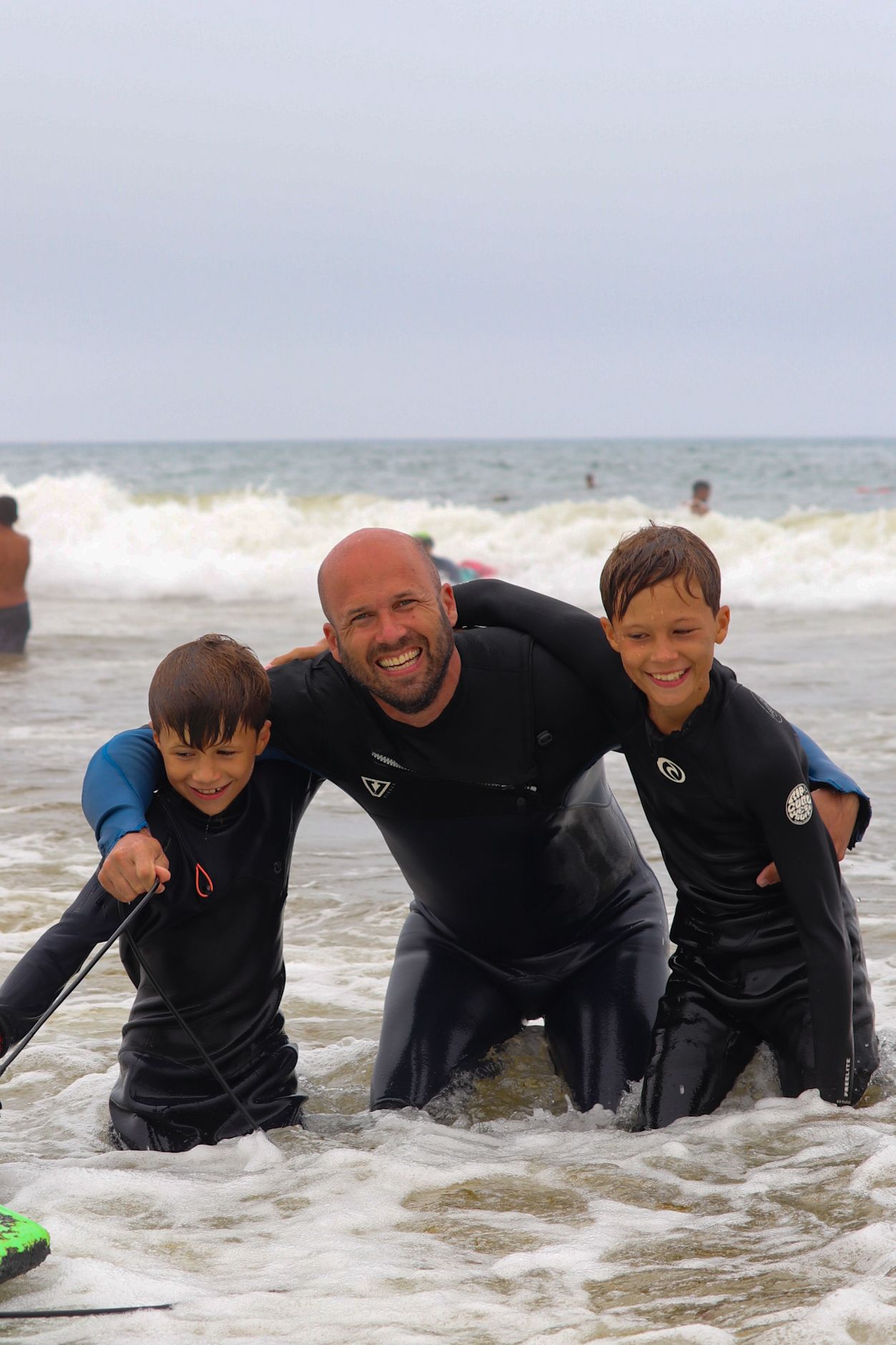 Family enjoying a surf holiday at a beachfront surf camp Taghazout in Morocco