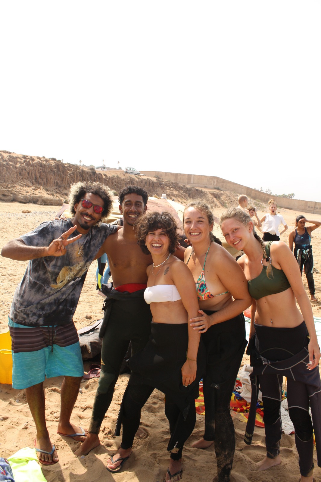 Group surf lesson at a Taghazout surf camp with instructors