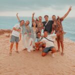 Group enjoying sunset after sandboarding taghazout near Atlantic coast