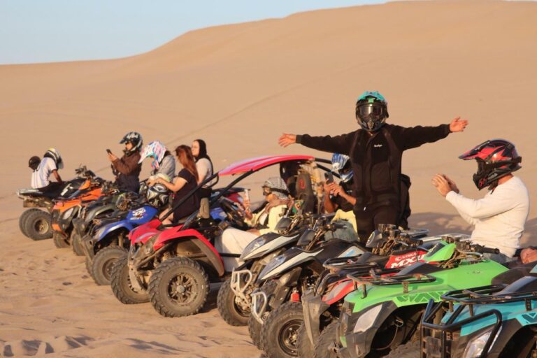 Group of travelers enjoying quad biking in desert during 4 Day Surf Yoga Sahara Quad Adventure Taghazout Morocco