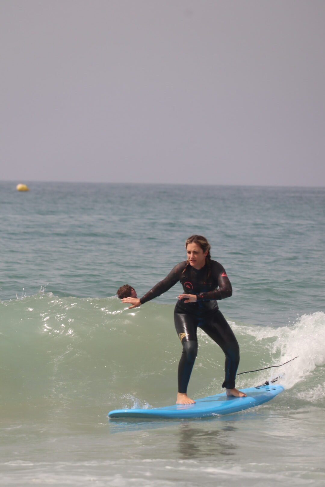 Student standing up on surfboard first wave Taghazout Morocco