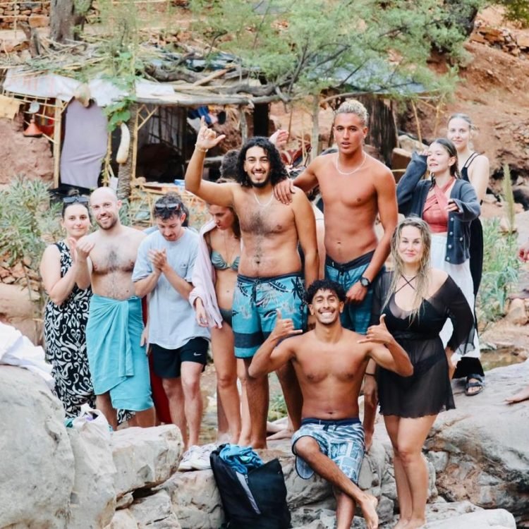 Panoramic view of Paradise Valley's natural pools surrounded by palm trees and Atlas Mountains