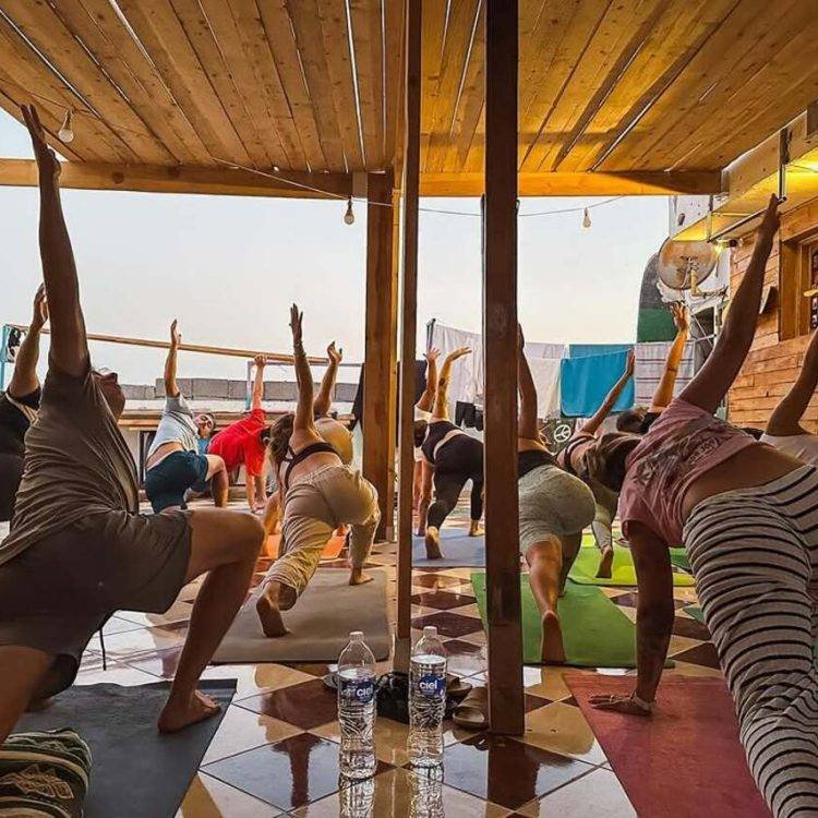 Yoga session on the rooftop terrace at Surf Camp Taghazout